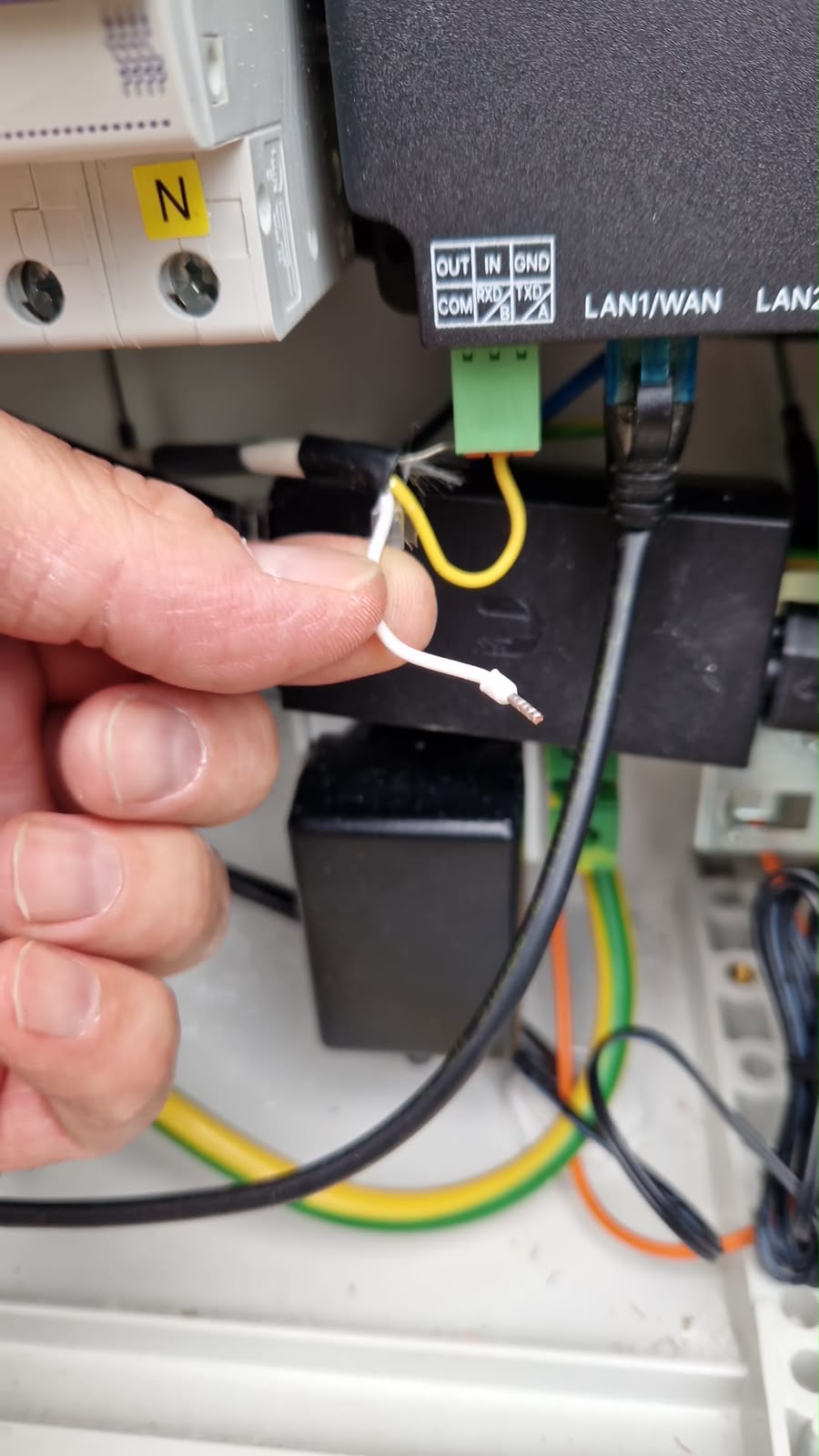 Inspection of a disconnected wire inside an electrical cabinet